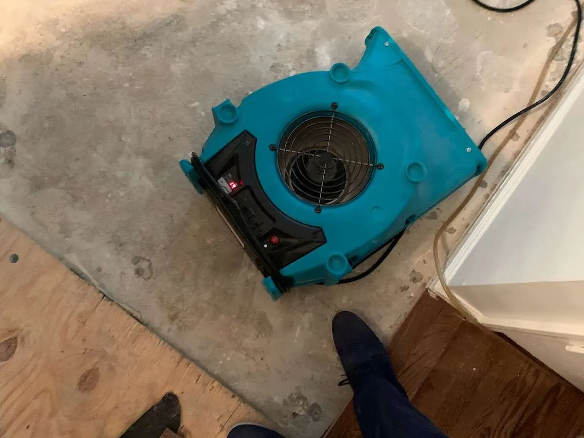 Air mover drying subfloor during Commercial Water Damage Restoration in Rockledge